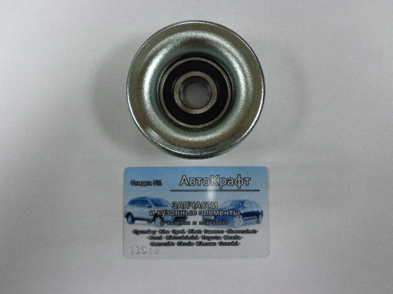 Ролик промежуточный приводного ремня Mazda 3 1.4/1.6L  ZJ01-15-940
